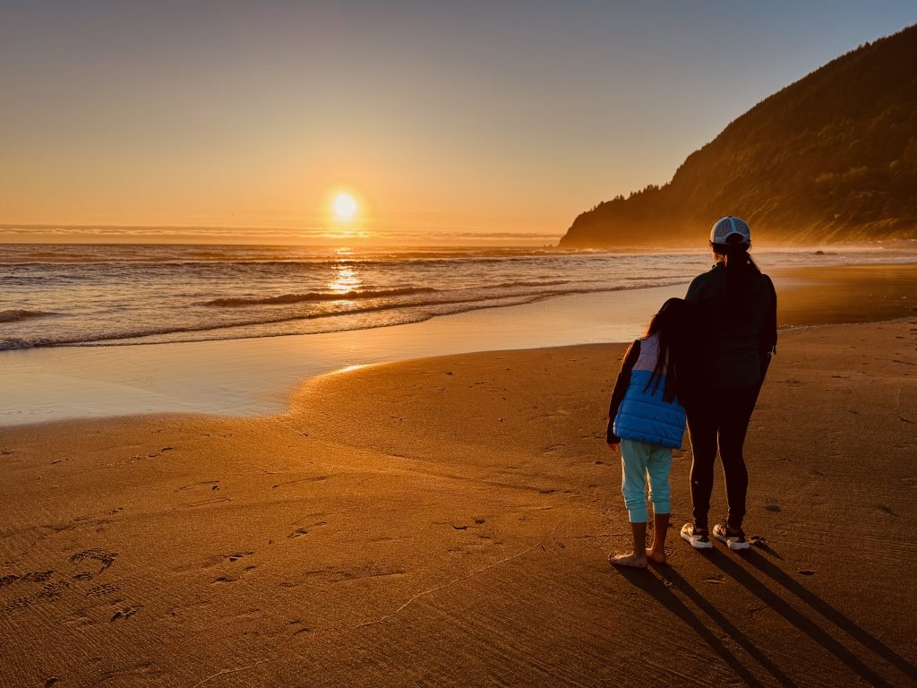 2025-07 Manzanita Beach, Oregon Taking in a colorful sunset after a day of exploring.